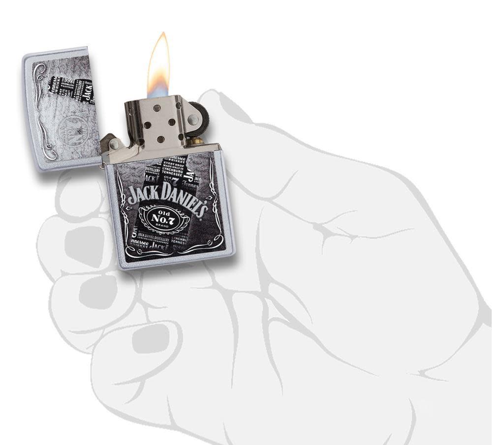 Jack Daniel's Text Design Satin Chrome Windproof Lighter lit in hand
