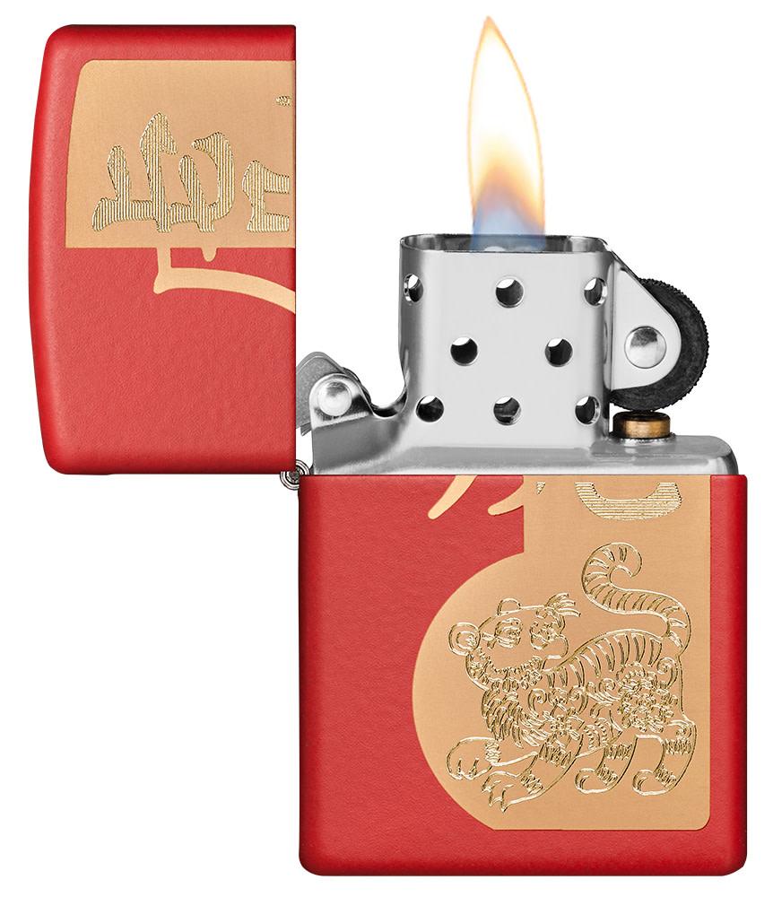 Year of the Tiger Design Red Matte Windproof Lighter with its lid open and lit.