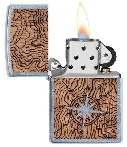 Front view of the WOODCHUCK USA Compass Lighter open and lit