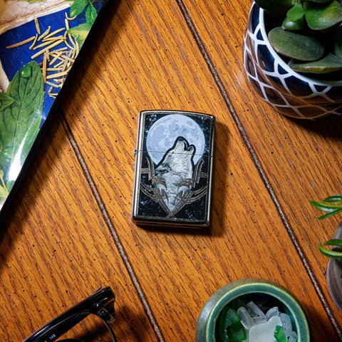 Lifestyle image of Howling Wolf Design Windproof Lighter laying on a side stand