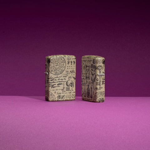 Lifestyle image of two Zippo Alchemy 540 Color Design Pocket Lighters standing in a purple scene, one lighter is showing the front of the design while the other shows the back.