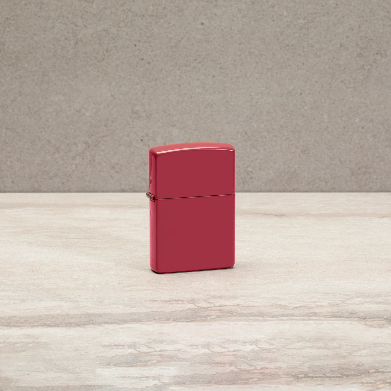 Lifestyle image of Classic Brick Windproof Lighter standing on a countertop. 