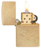 Cannabis Design Stamped Leaf Tumbled Brass Windproof Lighter with its lid open and lit.