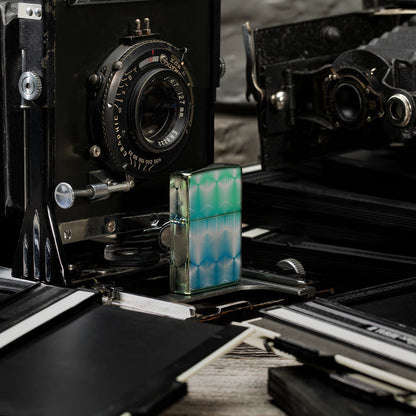 Lifestyle image of Pattern Design High Polish Teal Windproof Lighter standing with some vintage cameras.