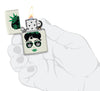 Zippo Cannabis Girl Design Glow In The Dark Pocket Lighter lit in hand.
