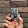 Lifestyle image of Firefighter Design Street Chrome™ Windproof Lighter in hand.
