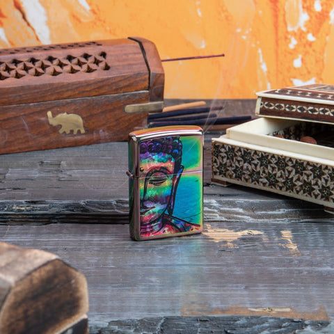 Lifestyle image of Bright Buddha Design Multi Color Windproof Lighter with incense in the background