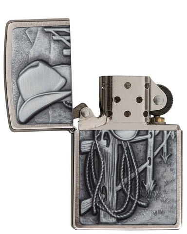 Resting Cowboy Windproof Lighter with its lid open and unlit.